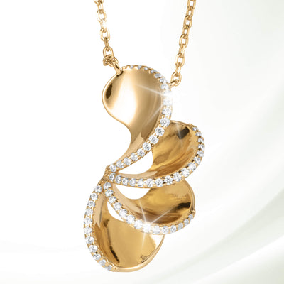 A luxurious gold Arianna Pendant with an elegant swirling design accented by sparkling crystals, showcased on a delicate gold chain, Up To 75% Off Retail.