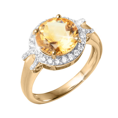 Gold tone ring featuring a large round yellow gemstone surrounded by a sparkling halo of clear stones and set in a polished band