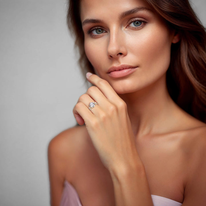 Woman wearing a gold plated sterling silver Baroque Ring on her finger, showcasing elegant jewelry for females with a soft, sophisticated look.