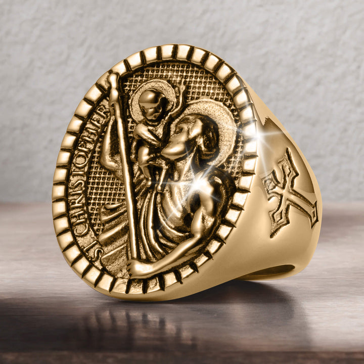 St. Christopher Ring in gold tone with a detailed Saint Christopher and child medallion plus an engraved cross on the side