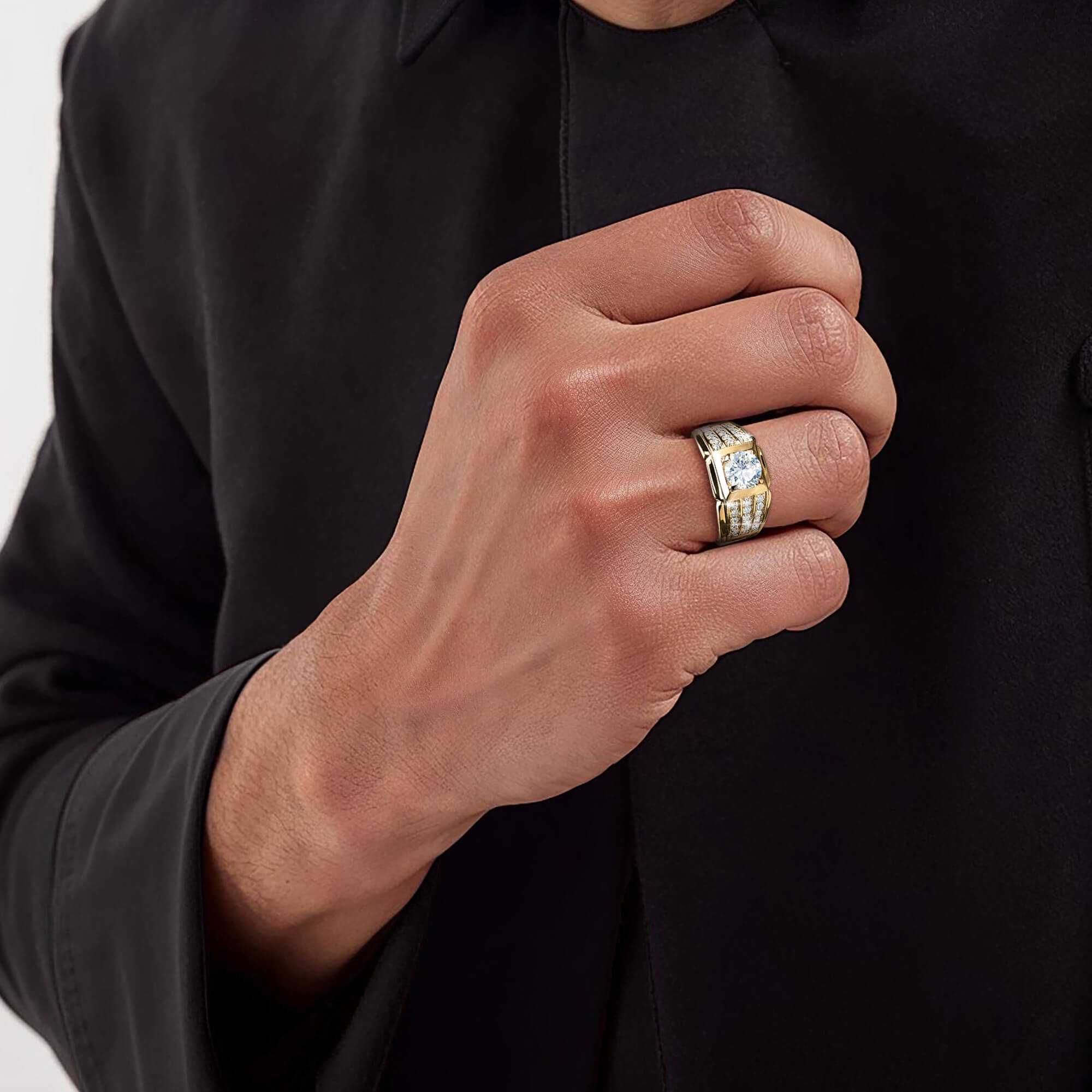 Male hand wearing Daniel Steiger Techmaster Gold Men's Ring