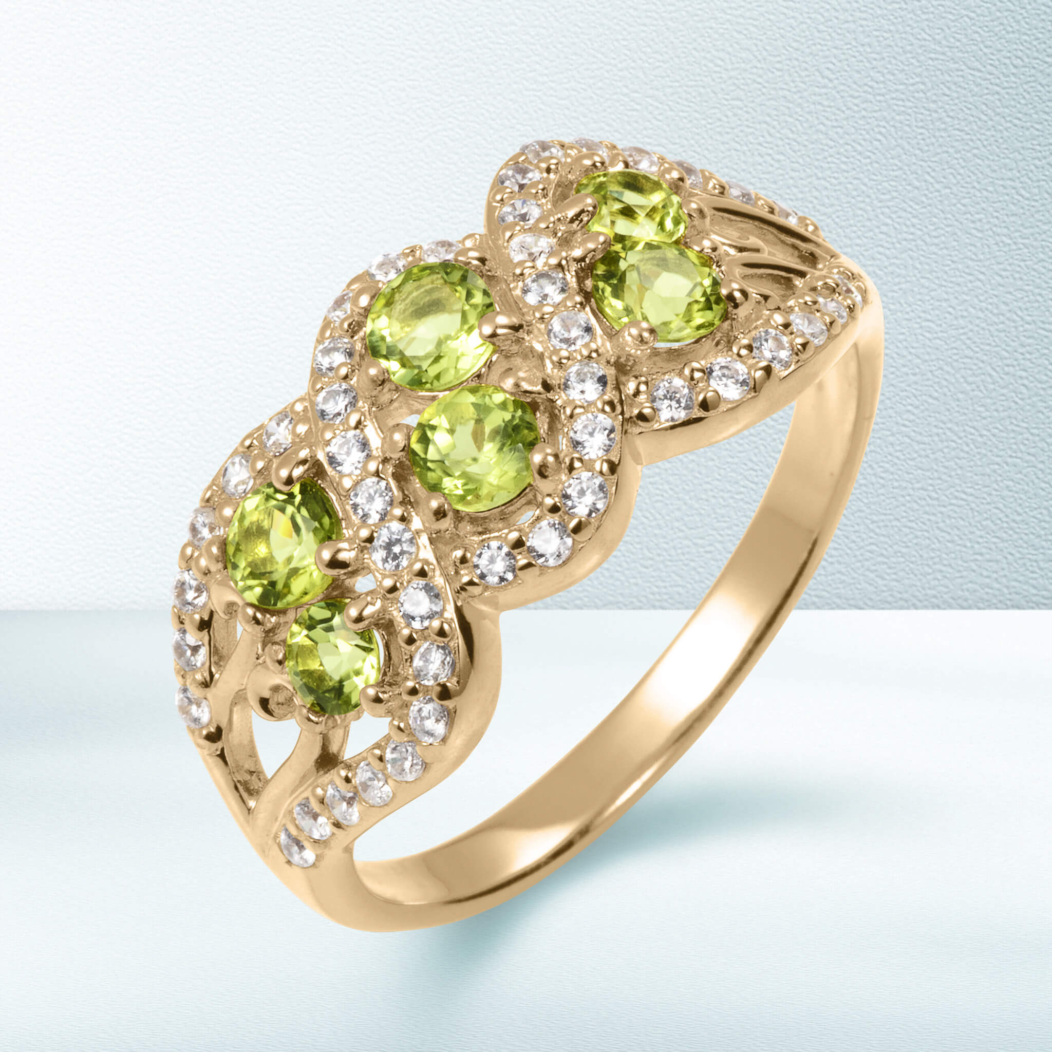 Elysian Peridot Ring with gold band featuring multiple round peridot stones surrounded by sparkling clear crystals, available Up To 75% Off Retail.