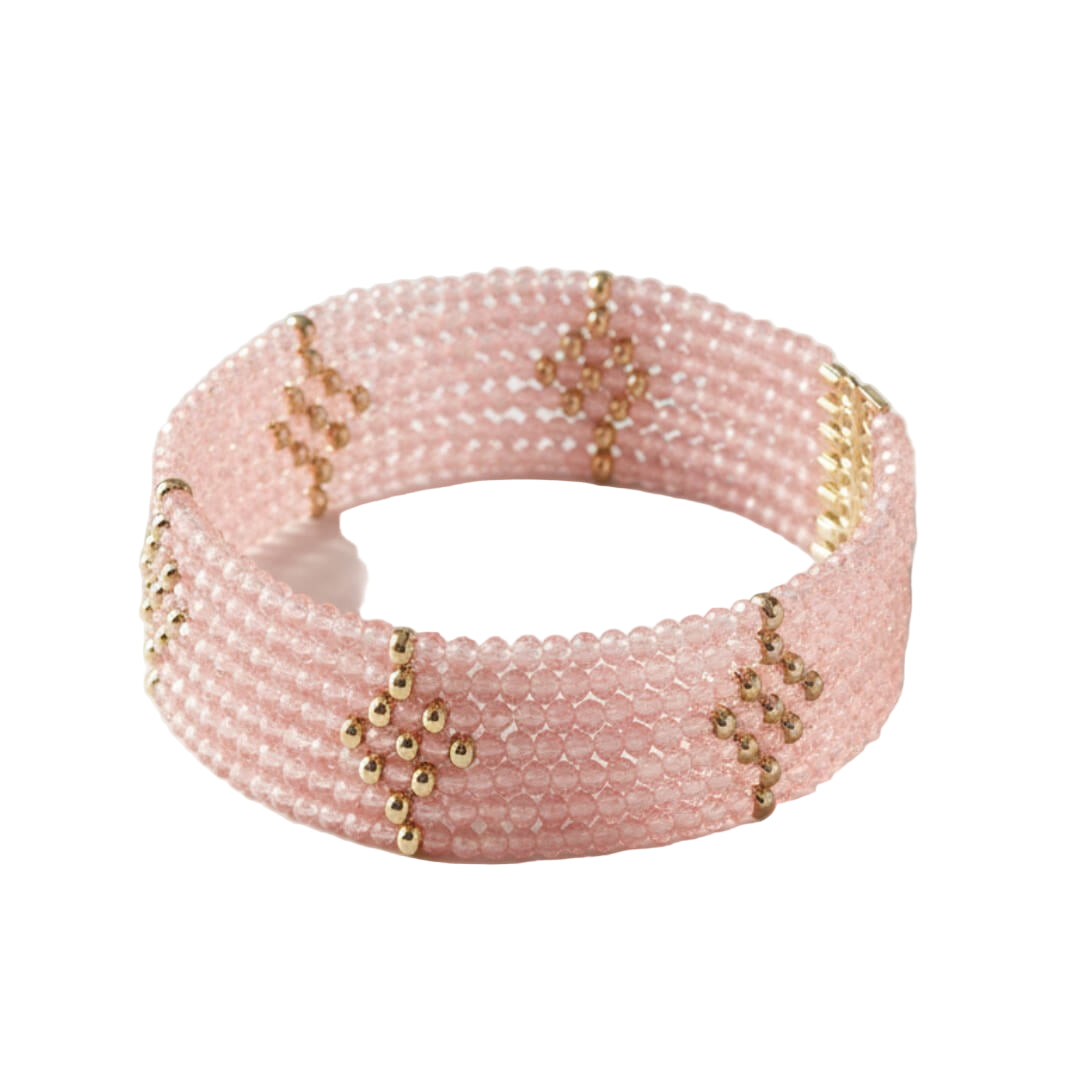 Pink beaded bracelet with gold accents on a white background. Rosa Cascade Bracelet