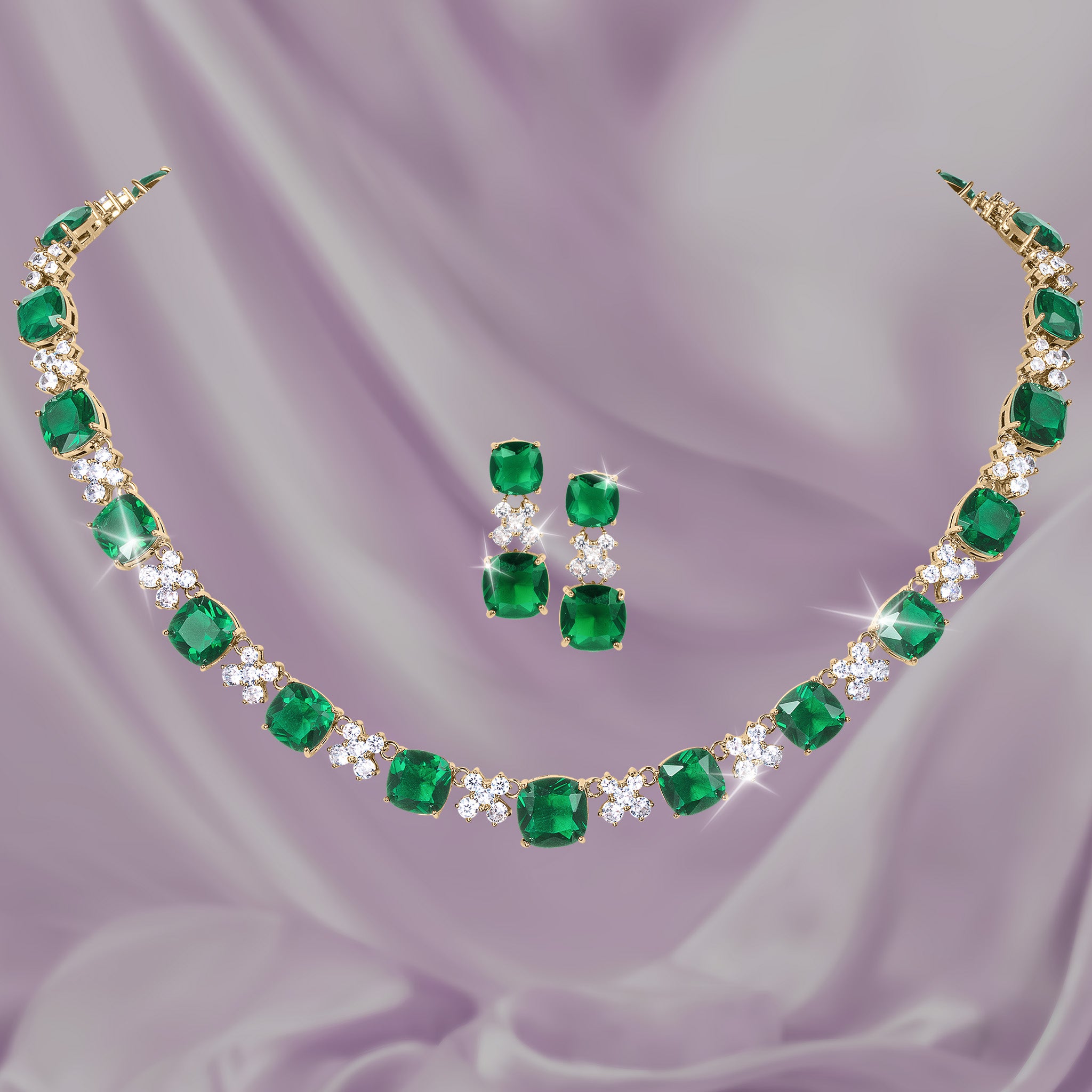 Freya Collection emerald green gemstone necklace and matching earrings displayed on lavender fabric Up To 75% Off Retail