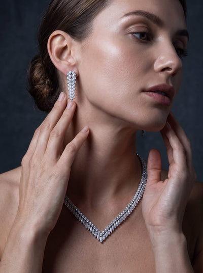 Crystal Cascade Earrings featuring sparkling cascading stones on a model with a matching crystal necklace for an elegant jewelry look and refined evening style