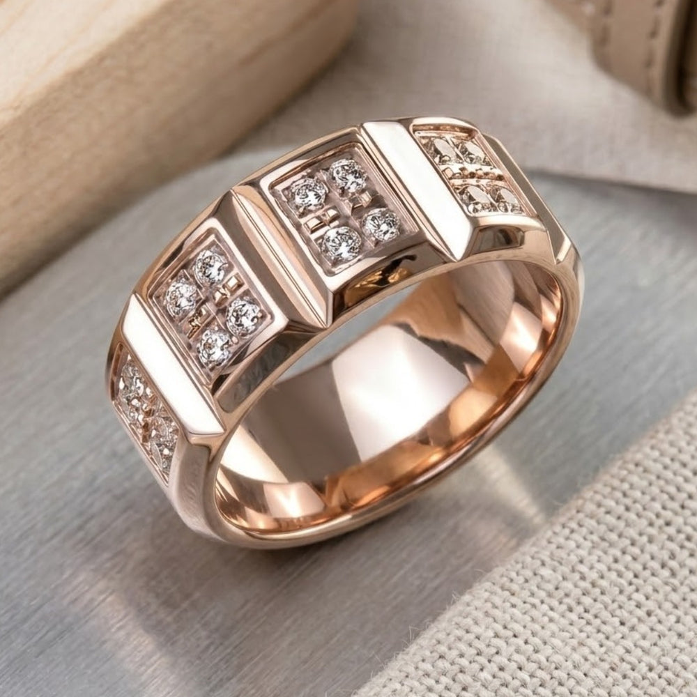 Rose gold ring with diamond accents on a light wooden surface
