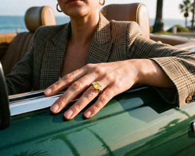 Sunlit Splendour Yellow Ring featuring a bright yellow gemstone worn on a hand resting on a vintage green car by the seaside Up To 75% Off Retail