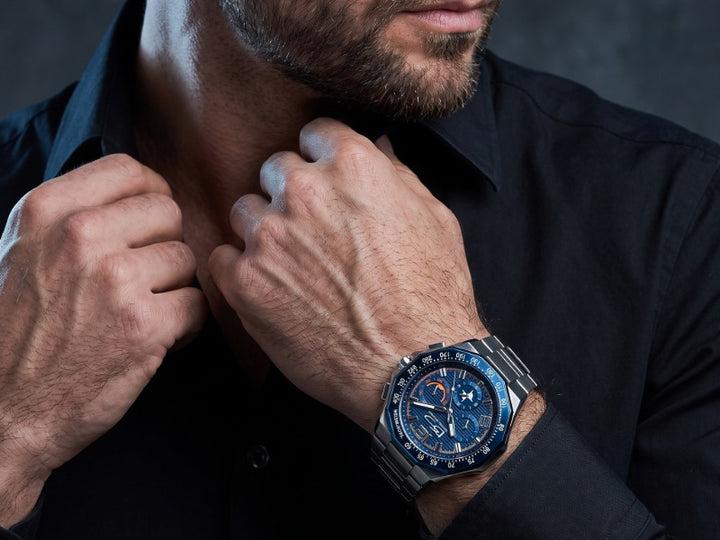 Ultima Men's Watch with a blue chronograph dial and stainless steel bracelet worn with a black shirt Up To 75% Off Retail