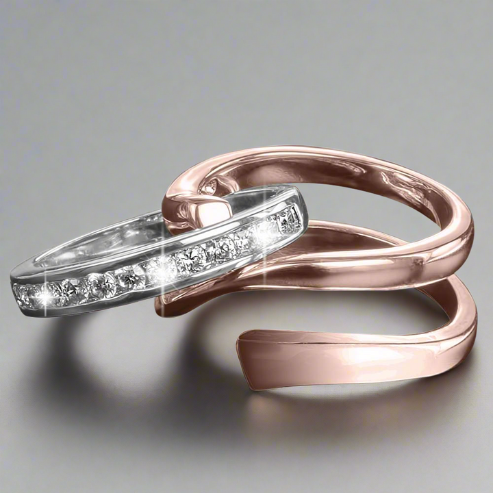 Twister Rose Gold Ring featuring a two-tone design with sterling silver and rose gold plating, adorned with sparkling clear stones for a stylish female jewelry statement.