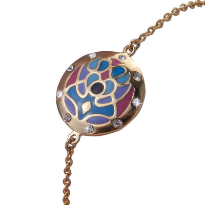 Golden Peacock Bracelet featuring a gold-plated stainless steel chain with a colorful peacock-inspired circular charm adorned with small sparkling stones for women.
