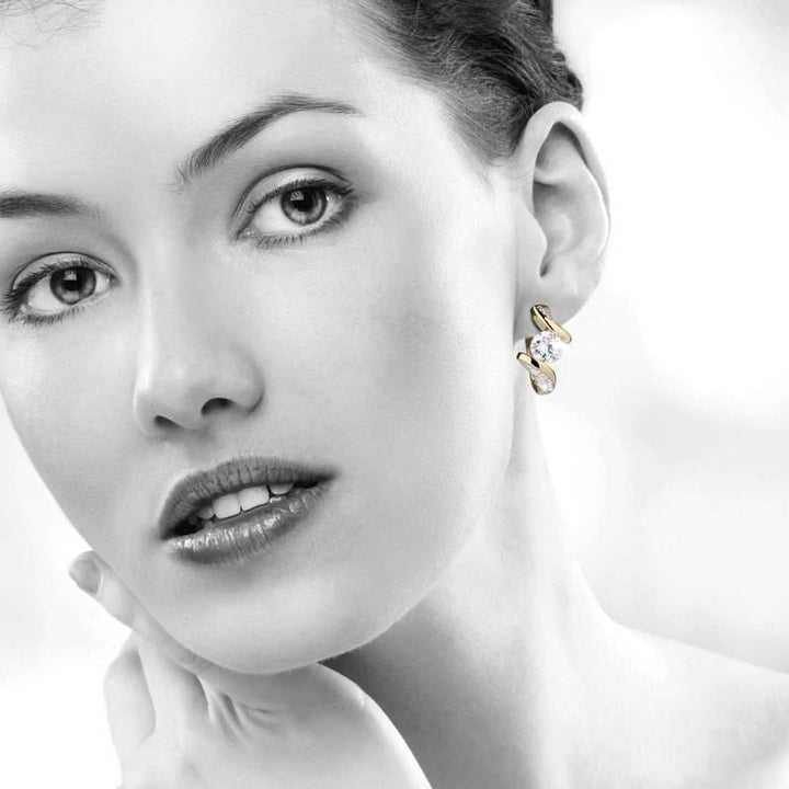 Close-up of a woman wearing Regalia Twist Earrings made of sterling silver, showcasing elegant jewelry designed for females with a twisted, refined style.