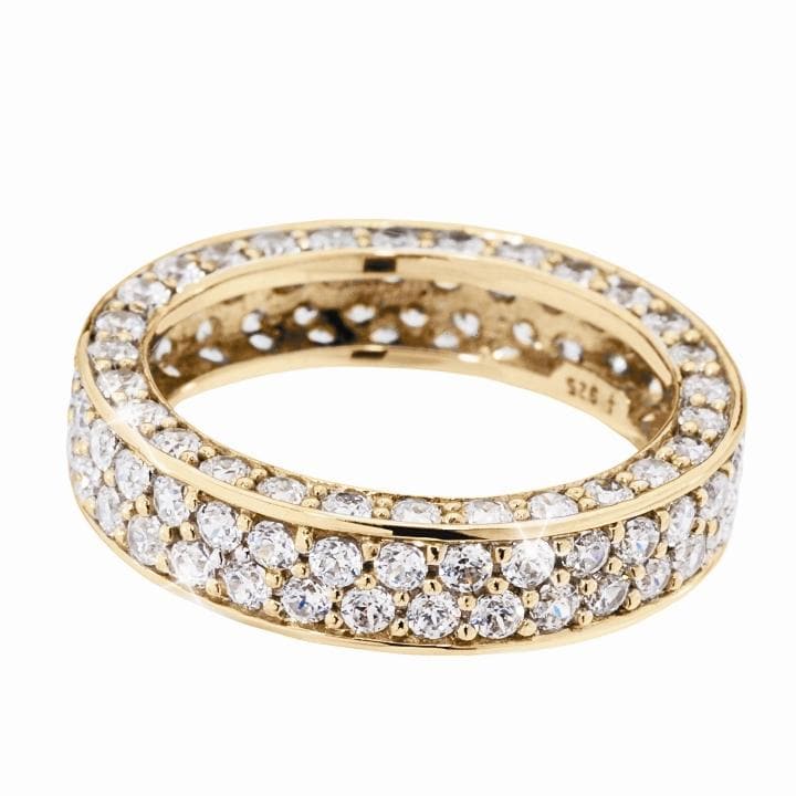 Gold Florence Eternity Ring featuring a sterling silver band plated in gold, encrusted with multiple sparkling stones, designed for women’s jewelry collections.