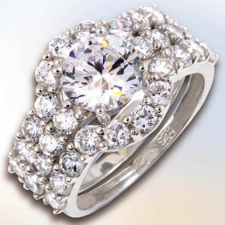 Monte Carlo Rings featuring a sterling silver band adorned with a large central sparkling gemstone surrounded by multiple smaller dazzling stones, designed for female jewelry lovers.