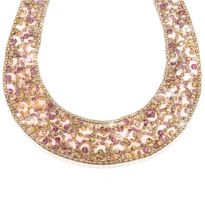 Spring Lace Necklace crafted from white base metal with gold plating, featuring intricate lace-like patterns adorned with sparkling pink and gold accents for a feminine jewelry statement.