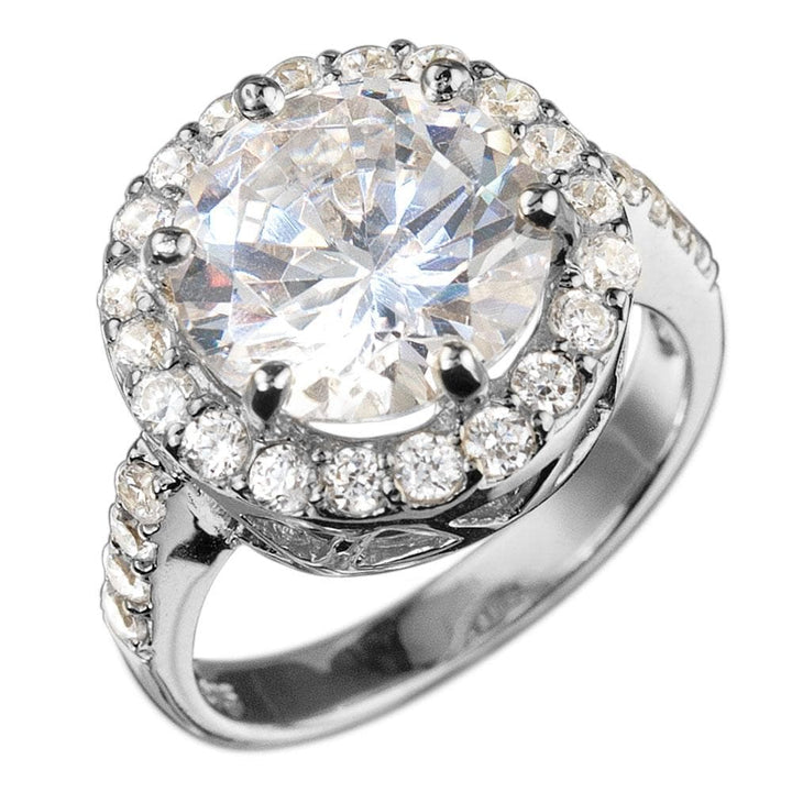 Close-up of a sterling silver Versailles Rhodium Ring for females, featuring a large round center stone surrounded by smaller sparkling stones on a rhodium-plated band.