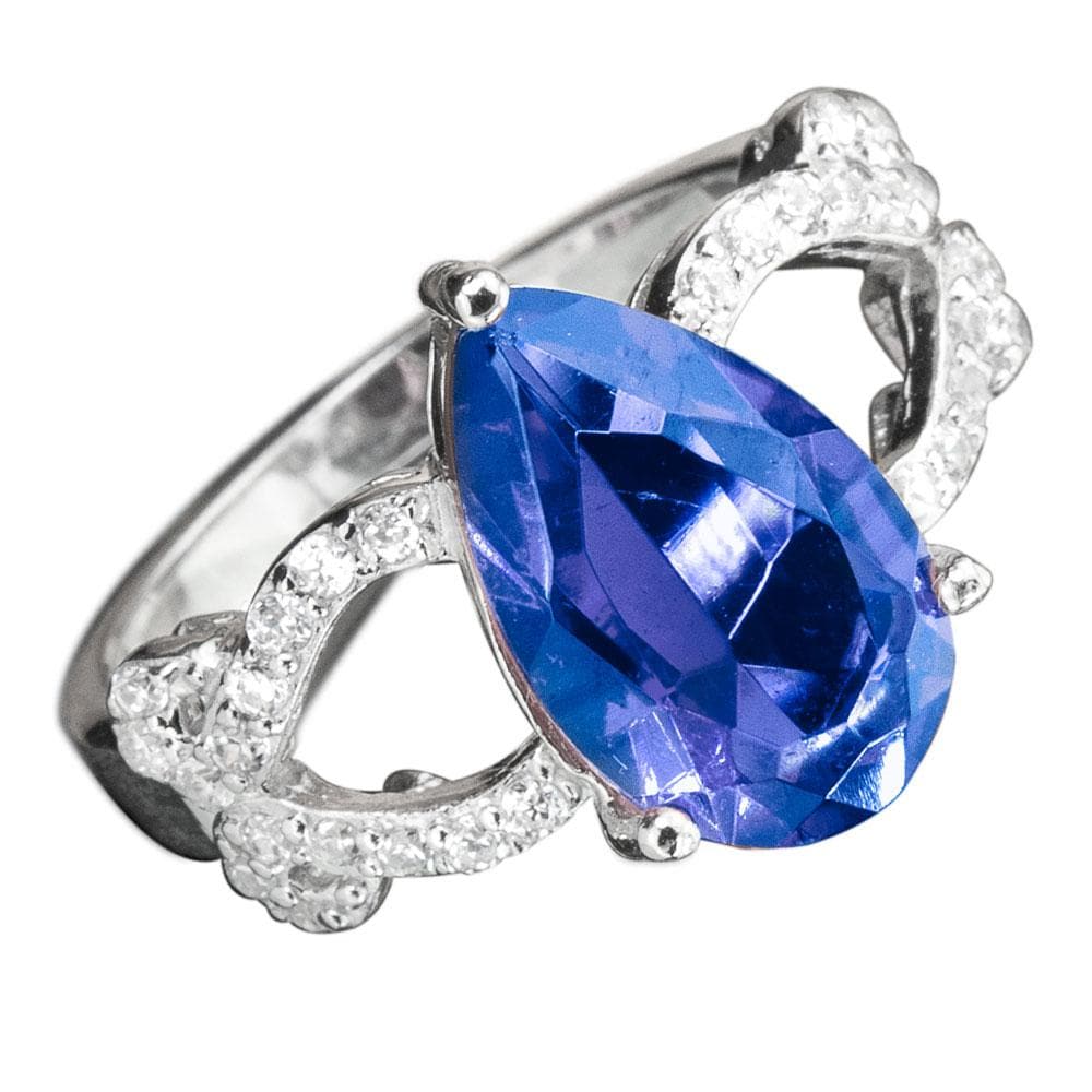 Essence Ring featuring a sterling silver band with an intricate design and a large pear-shaped blue gemstone, surrounded by small sparkling accents, designed for female jewelry lovers.