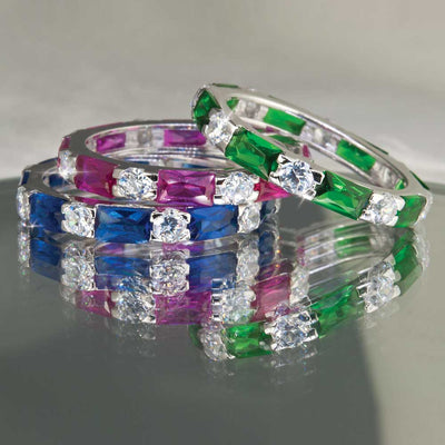 Three sterling silver Palm Beach Stacker Rings Red for female with rhodium plating, featuring rectangular colored gemstones in green, pink, and blue paired with sparkling clear stones.