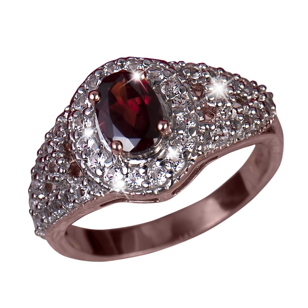 Rouge Garnet Ring featuring a deep red garnet center stone surrounded by sparkling clear stones on a polished stainless steel band designed for women’s jewelry.