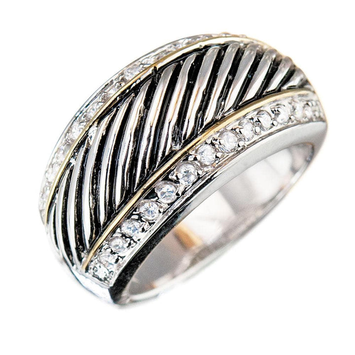 Monte Carlo Ring in two-tone sterling silver featuring diagonal striped detailing and rows of sparkling stones, designed as a unisex jewelry piece.