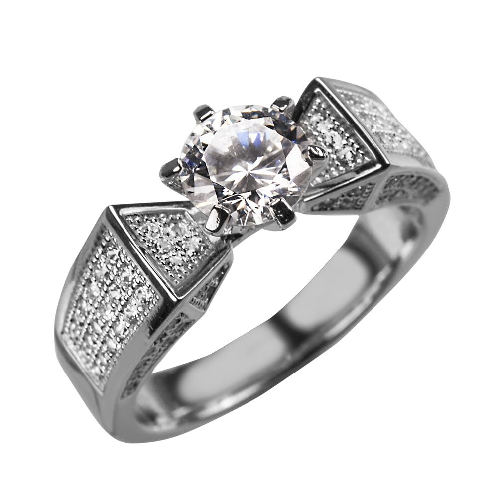 Sterling silver Star Solitaire Ring for women with rhodium plating featuring a prominent round solitaire stone and intricate side detailing, elegant jewelry piece.