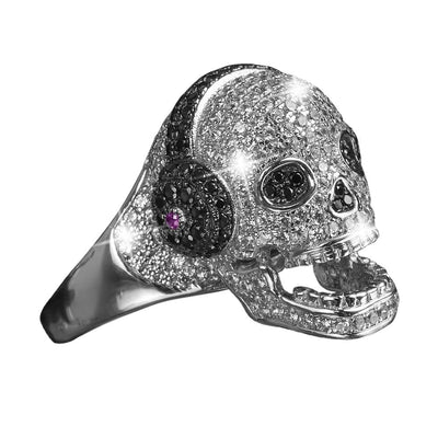 DJ Skull ring crafted from sterling silver with rhodium plating, featuring a skull design adorned with sparkling stones and black accents, designed for women’s jewelry.