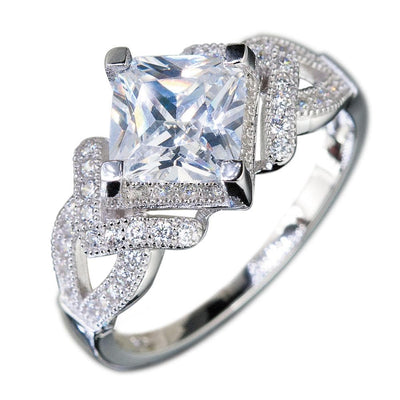 Palermo Rhodium Ring featuring a sterling silver band with intricate detailing and a large square-cut clear gemstone, designed for women’s jewelry collections.