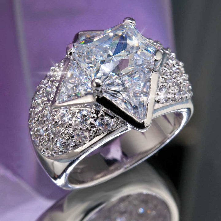 Star Cocktail Ring featuring a large central square-cut gemstone with a star-shaped sterling silver setting, accented by numerous small sparkling stones for an elegant female jewelry piece.