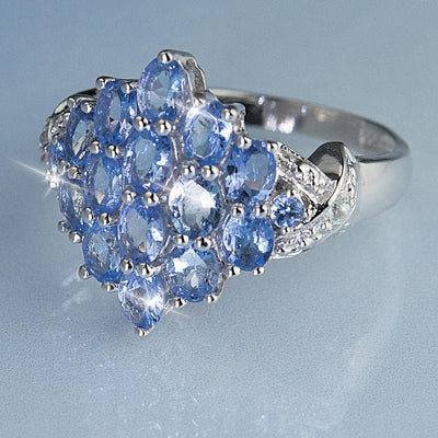 Close-up of a Tanzanite Cocktail Ring featuring multiple sparkling blue tanzanite gemstones set in sterling silver, designed for female jewelry enthusiasts.