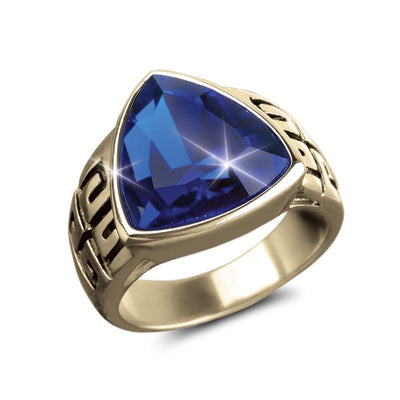 Franklin Ceylon Ring featuring a bold gold plating with a large triangular deep blue gemstone, designed as a stylish and masculine jewelry piece.