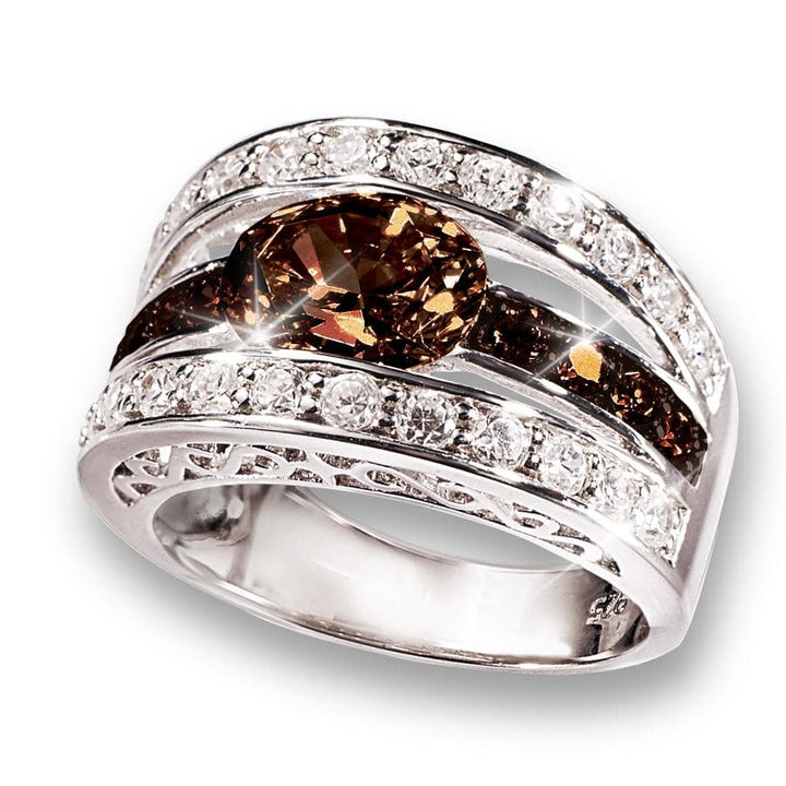 Verona Chocolate Ring featuring a sterling silver band with rhodium plating, adorned with a central chocolate-colored gemstone and sparkling clear stones for an elegant female jewelry piece.