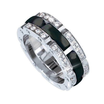 Ceramic Perfection Black Ring featuring a sleek black ceramic center band framed by polished silver and accented with sparkling clear stones, designed for women’s jewelry collections.