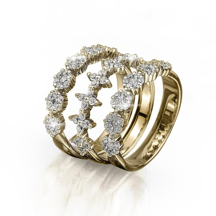 Blossom Trio Stacking Rings crafted in sterling silver with gold plating, featuring three elegant bands adorned with sparkling round-cut stones, designed for women’s jewelry.