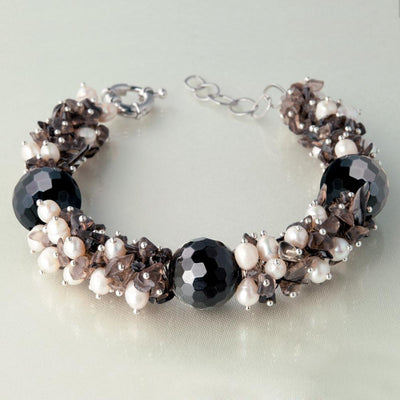 Smokey Garland Bracelet featuring faceted black gems and clustered pearls with smoky accents, designed as elegant female jewelry for sophisticated style.